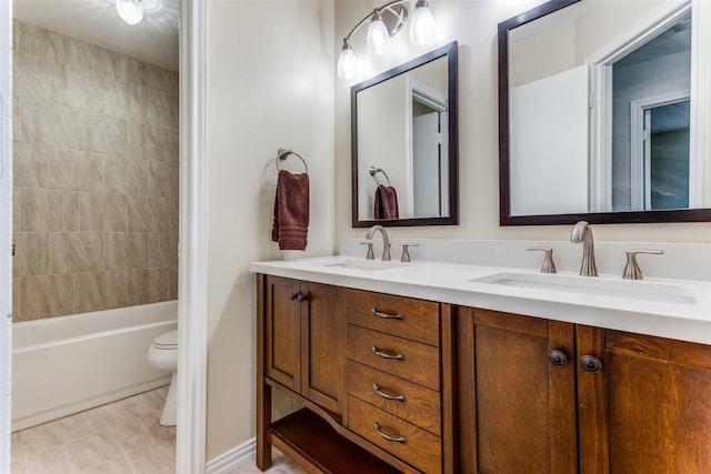 full bathroom with vanity, toilet, tiled shower / bath combo, and tile patterned flooring