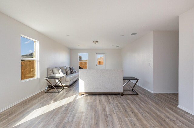 living room with light hardwood / wood-style floors