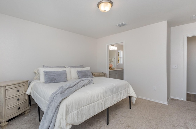 carpeted bedroom with ensuite bathroom