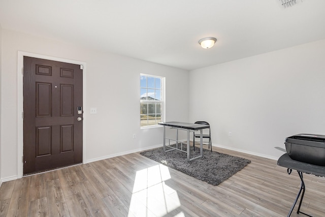 entryway with light hardwood / wood-style flooring