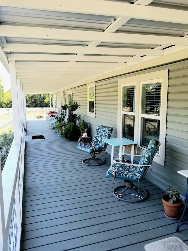 wooden deck featuring covered porch