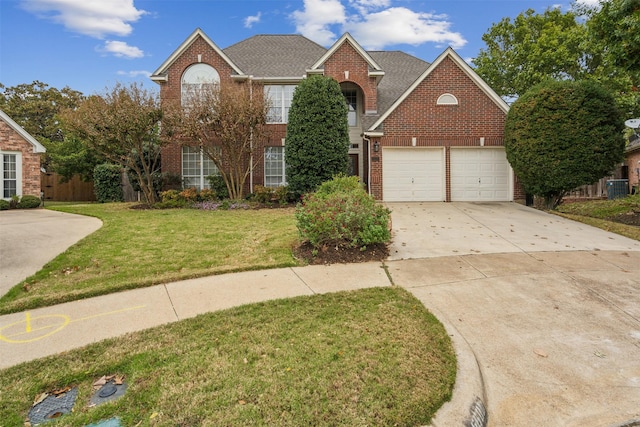 view of front property with central air condition unit and a front yard