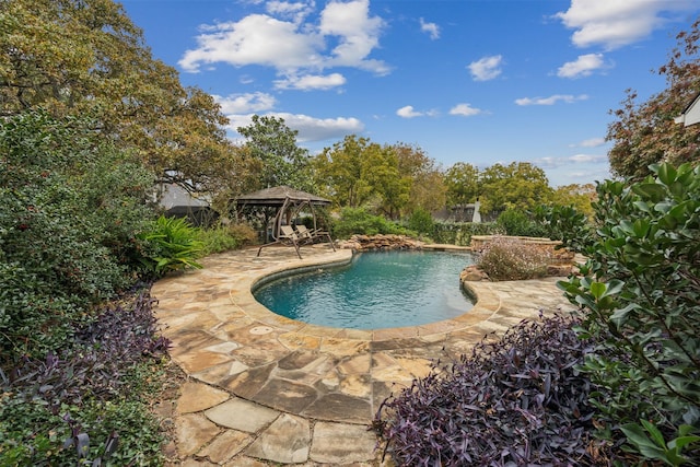 view of pool featuring a gazebo and a patio