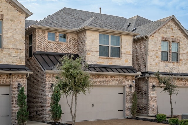 view of front of property featuring a garage