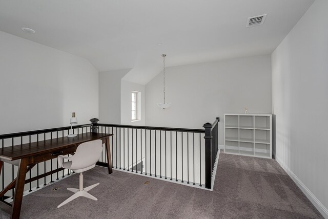 interior space with carpet flooring and vaulted ceiling