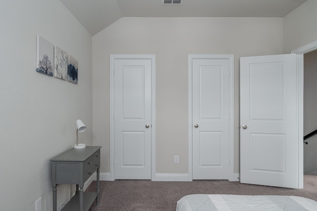 carpeted bedroom featuring lofted ceiling