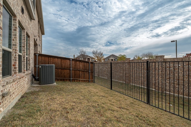 view of yard with central AC