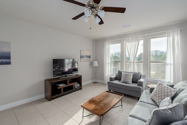 living room featuring ceiling fan and light tile patterned floors