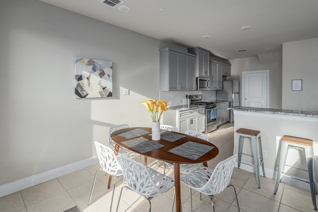 dining room with light tile patterned floors