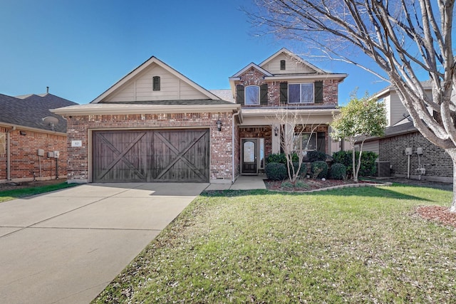 view of front of property featuring a garage and a front lawn