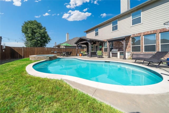 view of pool featuring a lawn, an outdoor kitchen, a gazebo, an in ground hot tub, and area for grilling