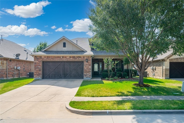 view of front of property with a front lawn, a garage, and cooling unit