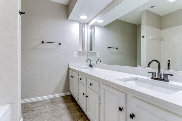 bathroom with vanity and hardwood / wood-style floors