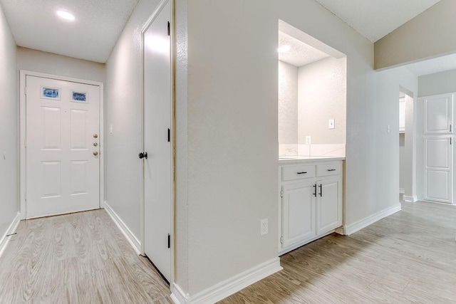 hall featuring light wood-type flooring