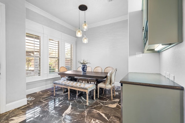 dining space with ornamental molding