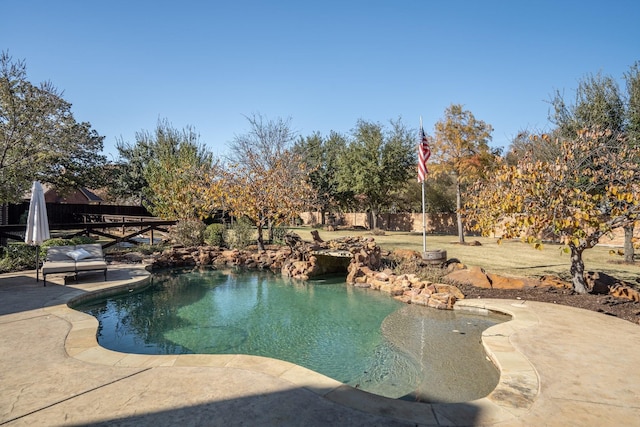 view of swimming pool with a patio area