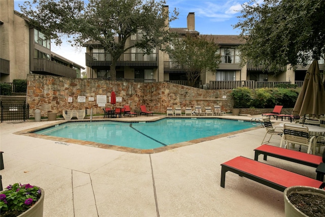 view of pool featuring a patio