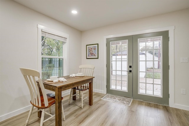 doorway to outside with french doors and light wood-type flooring