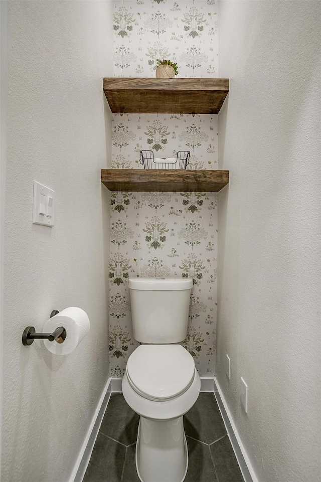 bathroom featuring tile patterned floors and toilet