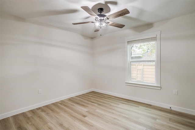 spare room featuring light hardwood / wood-style floors and ceiling fan