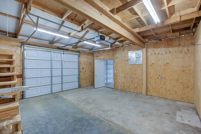 garage featuring wooden walls