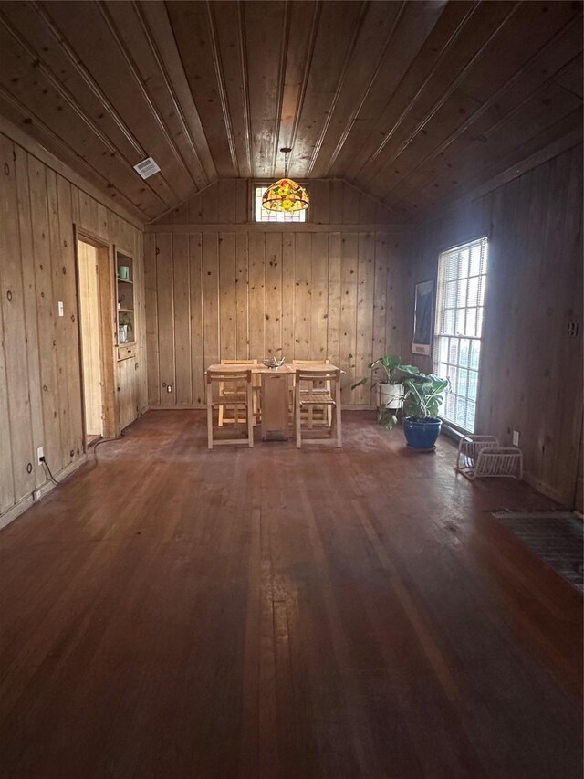 miscellaneous room with a healthy amount of sunlight, lofted ceiling, wooden ceiling, and wood-type flooring