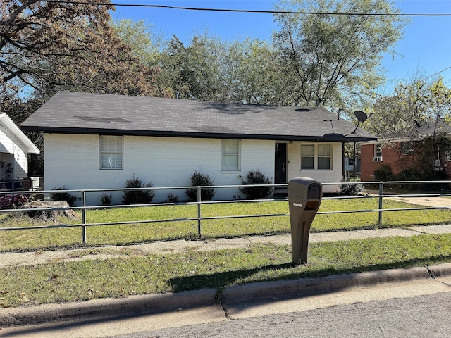 ranch-style home with a front yard