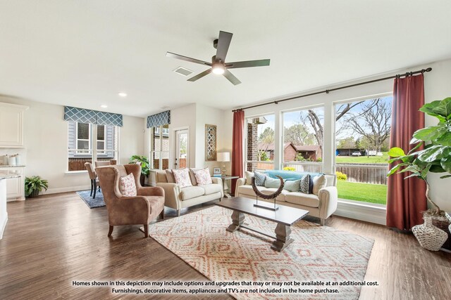 living room featuring ceiling fan and dark hardwood / wood-style flooring