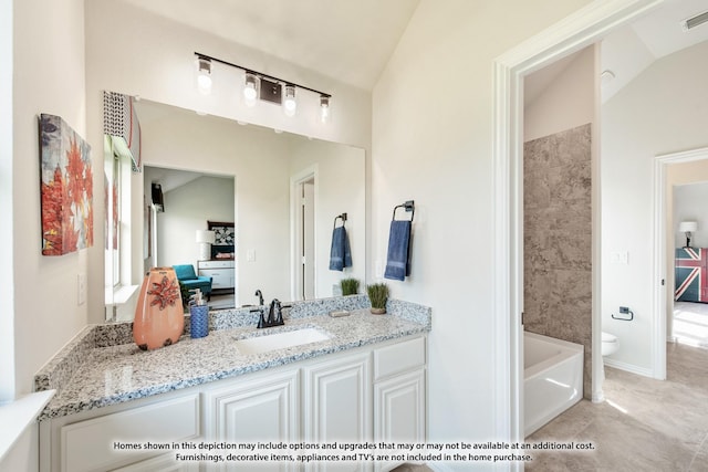 full bathroom featuring vanity, vaulted ceiling, tile patterned flooring, tiled shower / bath combo, and toilet