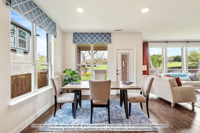 dining space featuring dark hardwood / wood-style flooring