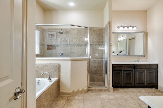 bathroom featuring tile patterned flooring, vanity, and independent shower and bath