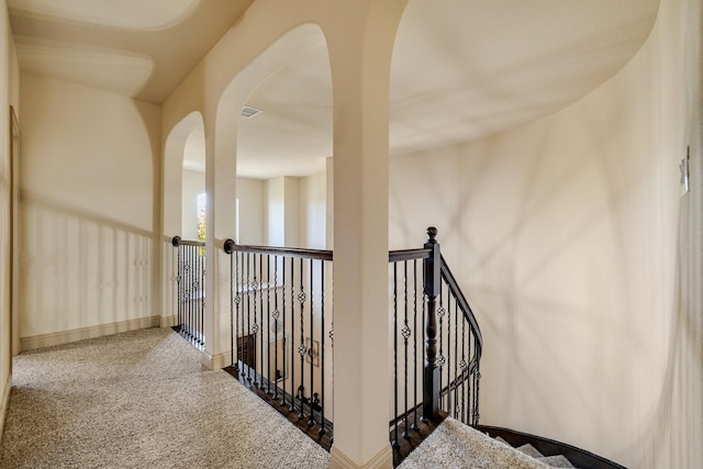 hallway with carpet floors