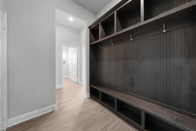 mudroom with light hardwood / wood-style flooring