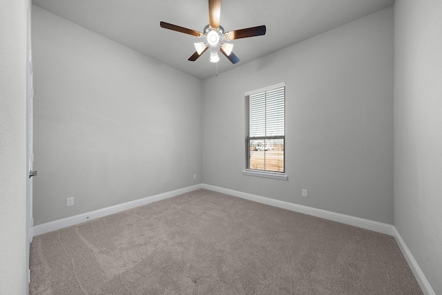 empty room with ceiling fan and carpet floors