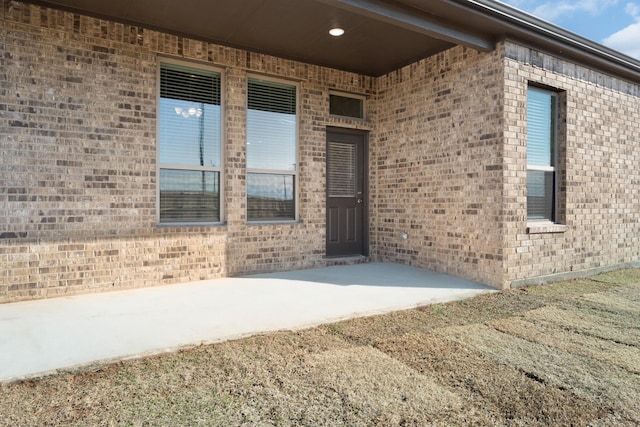 property entrance with a patio area