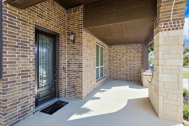 doorway to property with covered porch