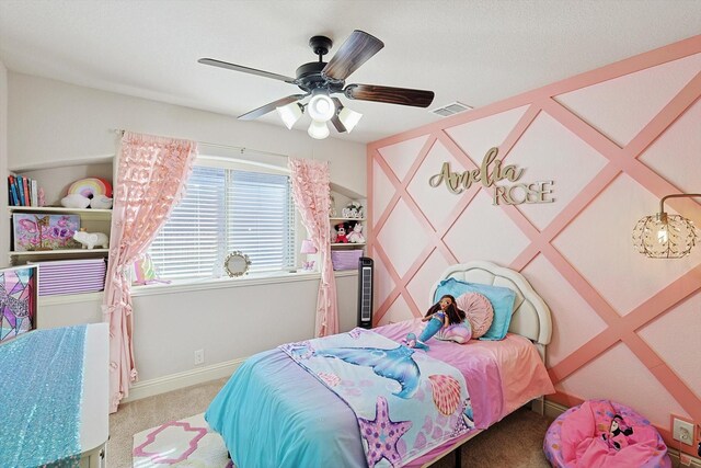 carpeted bedroom with ceiling fan and vaulted ceiling