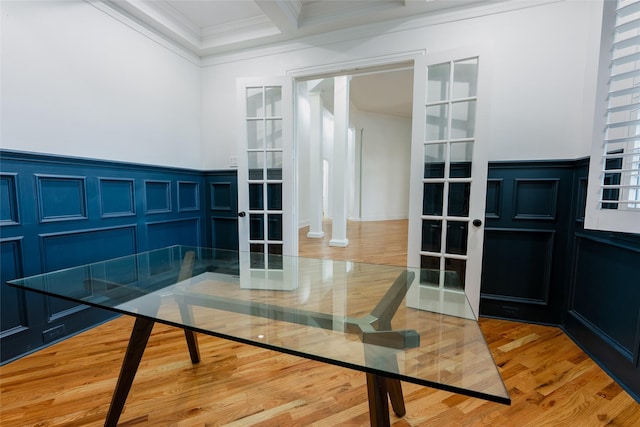 interior space featuring french doors, wood-type flooring, and ornamental molding