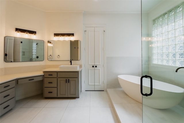 bathroom with a bath, vanity, tile patterned floors, and plenty of natural light