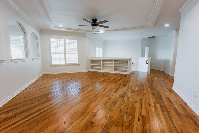 unfurnished room with hardwood / wood-style flooring, ceiling fan, and ornamental molding