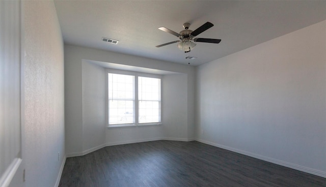 unfurnished room with dark hardwood / wood-style floors and ceiling fan