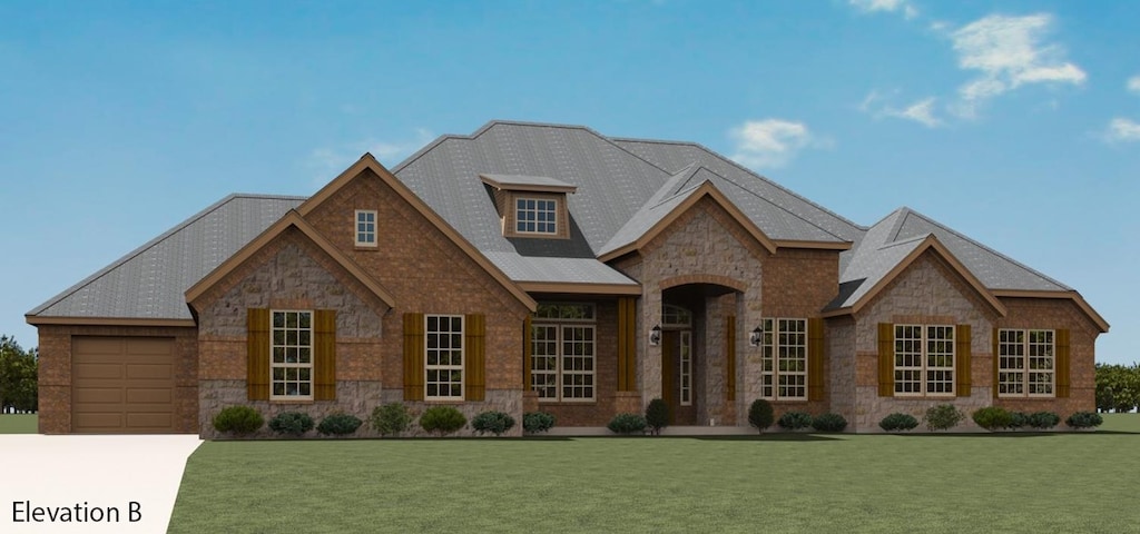 view of front of home with a garage and a front lawn