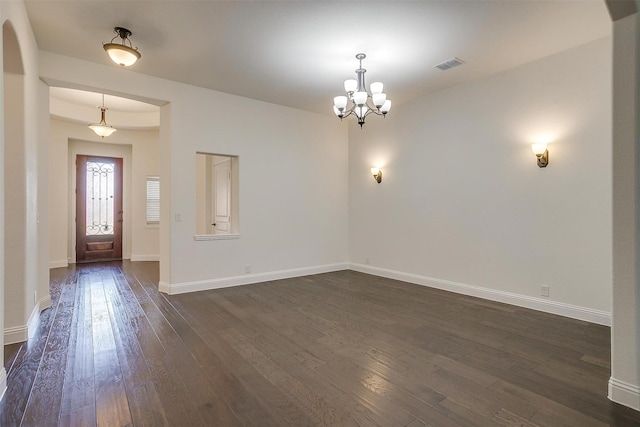 interior space with dark hardwood / wood-style flooring and a chandelier