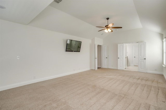 unfurnished room with light colored carpet, ceiling fan, and lofted ceiling