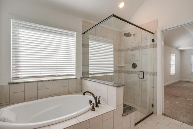 bathroom featuring tile patterned flooring, plus walk in shower, and vaulted ceiling