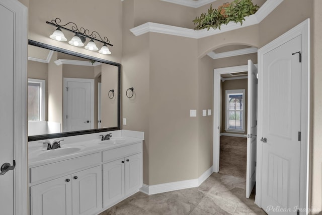 bathroom with ornamental molding and vanity