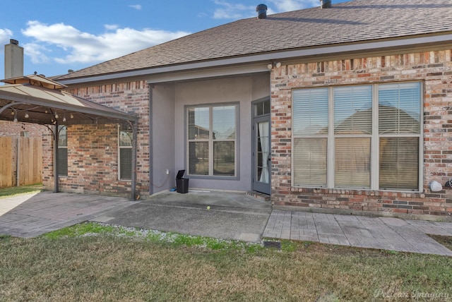 rear view of property featuring a patio area