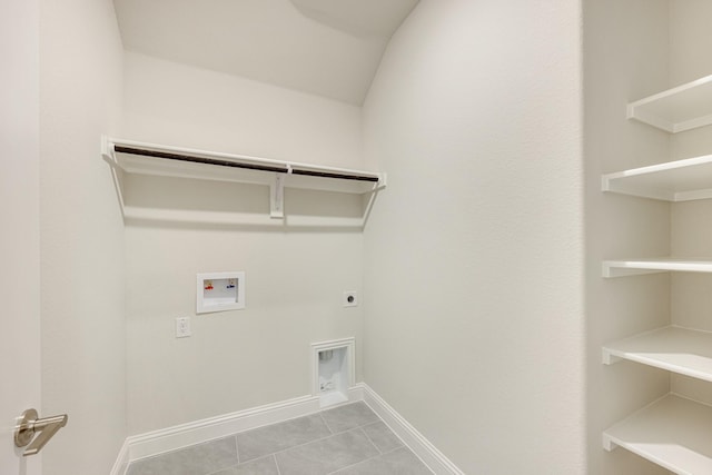 laundry room with electric dryer hookup, light tile patterned flooring, and hookup for a washing machine