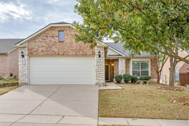 view of front of home featuring a garage and a front lawn