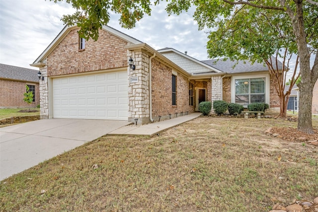 view of front of house with a front yard and a garage